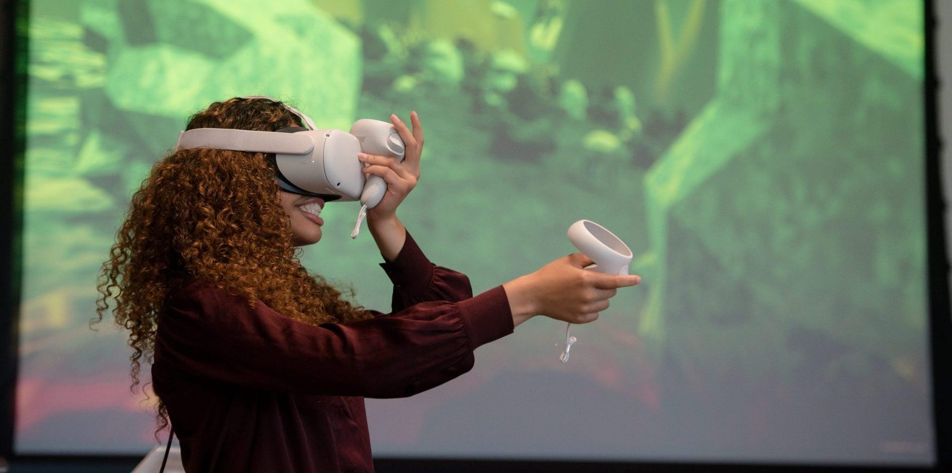 Student wears VR headset during presentation