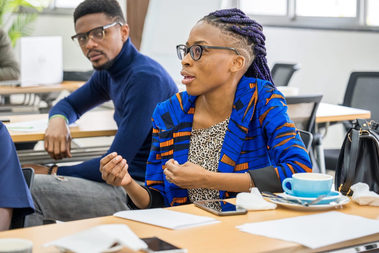 Ofentse Phuti sits in a classroom