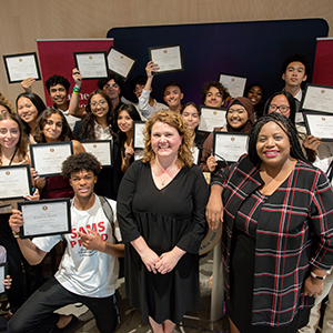 Students hold up awards during SAMS Symposium