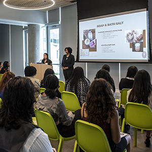 Audience watches student presentation